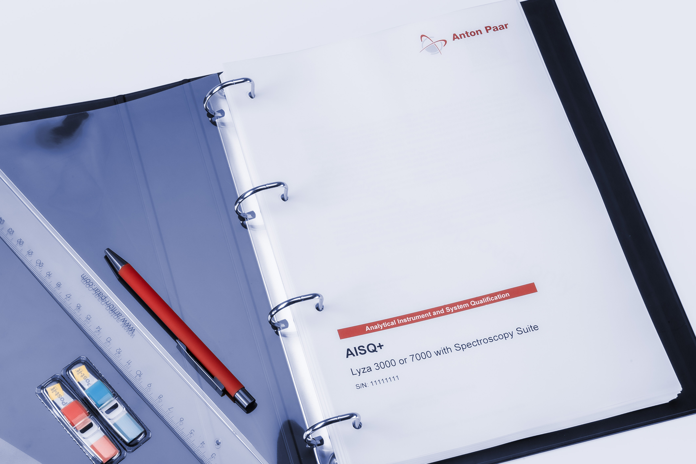 Open ring binder labeled “AISQ+ Lyza 3000 or 7000 with Spectroscopy Suite” by Anton Paar, with ruler, pen, and calibration standards beside it
