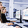 Two laboratory technicians operating computers displaying software interfaces for the Anton Paar iSorb HP high-pressure gas sorption analyzer. The screens show schematic diagrams of gas flow paths and system settings, highlighting precise control and monitoring capabilities for high-pressure gas sorption experiments. The lab environment includes advanced instrumentation in the background.