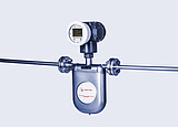 The image shows an Anton Paar L-Cor 8000 Coriolis flow meter, a high-precision inline instrument used for measuring fluid properties directly in industrial processes.
