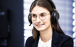 Anton Paar employee wearing a headset conducting a customer webinar from an office workstation.