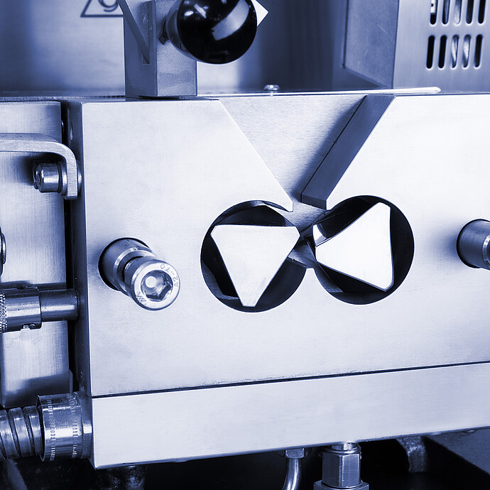 Close-up of the stainless-steel twin-rotor mixing chamber on a Brabender MetaStation modular torque rheometer.