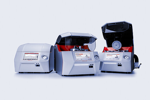Three Anton Paar Multiwave 7x01 microwave digestion systems, two open showing rotors and cavity lids, on a light studio background