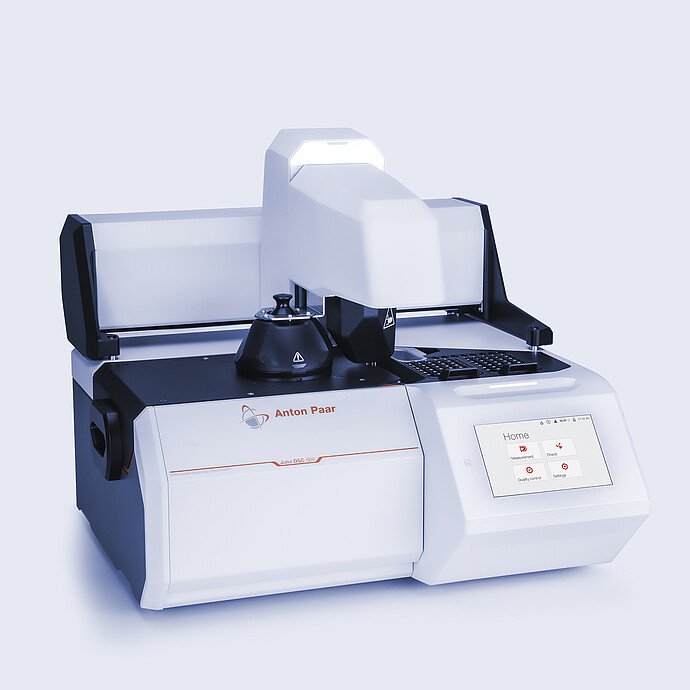 Anton Paar Julia DSC 500 with automated sample changer and integrated touchscreen showing home menu, on a neutral background