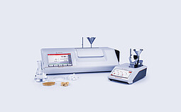 MCP Sucromat polarimeter and Abbemat refractometer with sugar samples and glassware for measuring sugar content, dry substance, and purity.