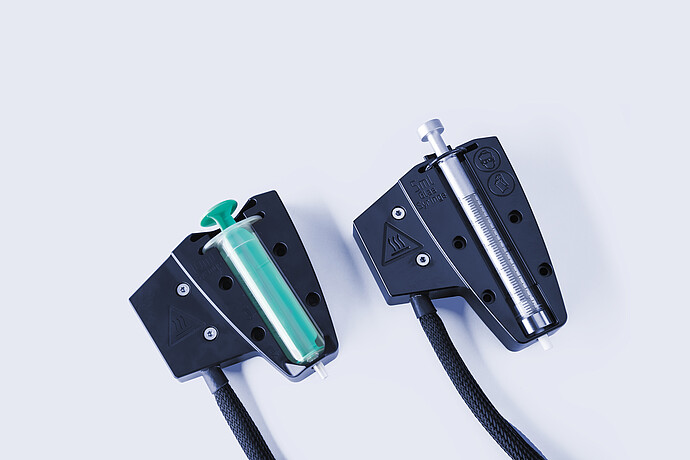 Two heated syringe holders for Anton Paar Xsample 610 sample changer with 10 mL and 5 mL syringes and black cables