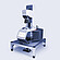 Anton Paar MCR 703 rheometer equipped with the Rheo-Iris optical accessory, mounted on a vibration-damping table with active touchscreen display.