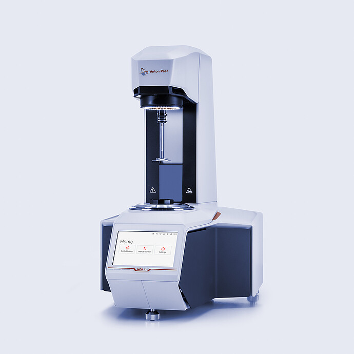 Anton Paar MCR 93 Modular Compact Rheometer in three-quarter view with open measuring area and touchscreen home menu.