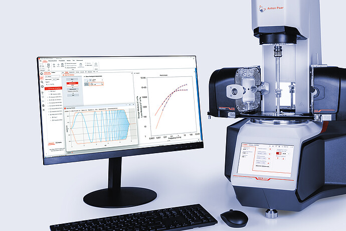 Anton Paar Modular Compact Rheometer MCR 503 with temperature accessories and RheoCompass graphs on a monitor