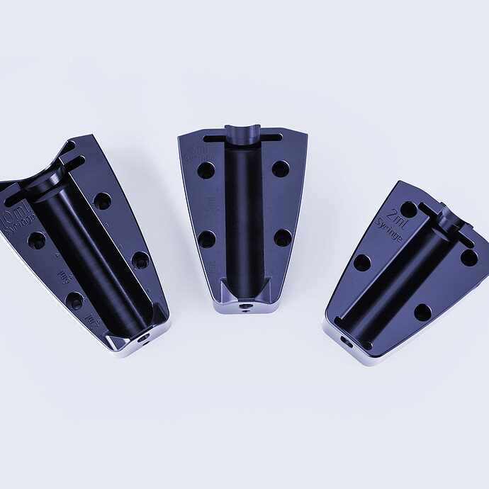 Three syringe adapters for the Xsample 340 sample changer, marked for 10 mL, 5 mL, and 2 mL syringes