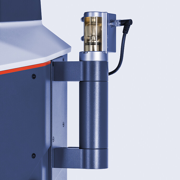 Close-up of the automatic piercing device mounted on the Anton Paar TPO 5001 for oxygen measurement in sealed beverage containers.
