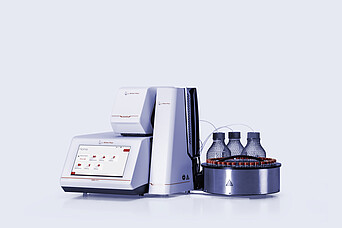 Anton Paar DMA 5002 density meter with Xsample 631 sample changer, vial carousel, bottles, tubing, and Xsample module