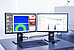 Dual-monitor setup with SAXSanalysis Pro software displaying scattering curves, size distribution analysis, and detector control interface.