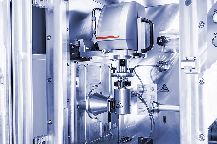 Anton Paar DSR 502 measuring head installed in a Rheo-SAXS setup with cables and a cylindrical sample component