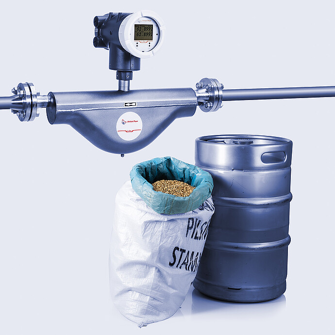 The Type B L-Cor 4000 Coriolis mass flow meter sitting alongside samples for beer brewing