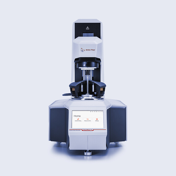 Anton Paar SmartPave 93 dynamic shear rheometer in front view with measuring geometry and touchscreen home menu.