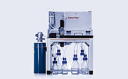PoreMaster eGaIn Filling Station with six lab bottles connected by tubing, integrated valve unit, and pressure vessel on the left.