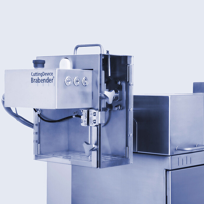 TwinLab Series extruder close-up with Brabender CuttingDevice mounted at the outlet, showing controls and guard.