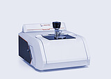 Anton Paar Lyza 3000 FTIR spectrometer with a sample holder centered on its measurement area against a light gray background.