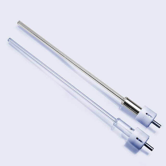 Two eGaIn-compatible nozzles for the Anton Paar PoreMaster Filling Station, one in stainless steel and one in transparent plastic, with standard connector fittings.