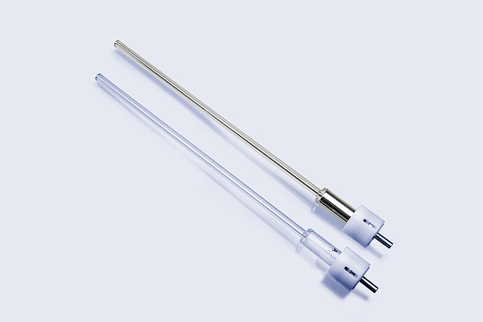 Two eGaIn-compatible nozzles for the Anton Paar PoreMaster Filling Station, one in stainless steel and one in transparent plastic, with standard connector fittings.
