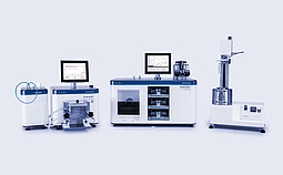 Brabender FarinoGraph, ExtensoGraph, and Amylograph-E arranged side by side with monitors, showing dough mixing, stretching, and viscosity analysis instruments in a lab setup