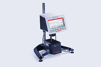 Three-quarter front view of the ViscoQC 300 rotational viscometer with the PTD 80 Peltier temperature device against a light blue background