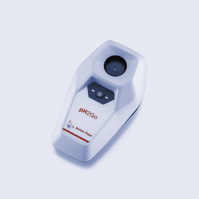 Handheld Anton Paar pH2Go digital pH meter on a light background, showing the circular sample well, control button, and compact housing.