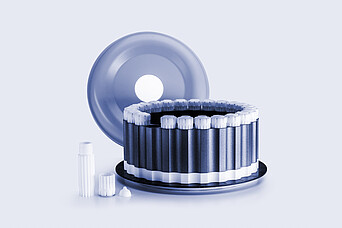 HVT Rotor with circular arrangement of sealed digestion vessels, removed lid positioned behind, and individual vessel components on a light background