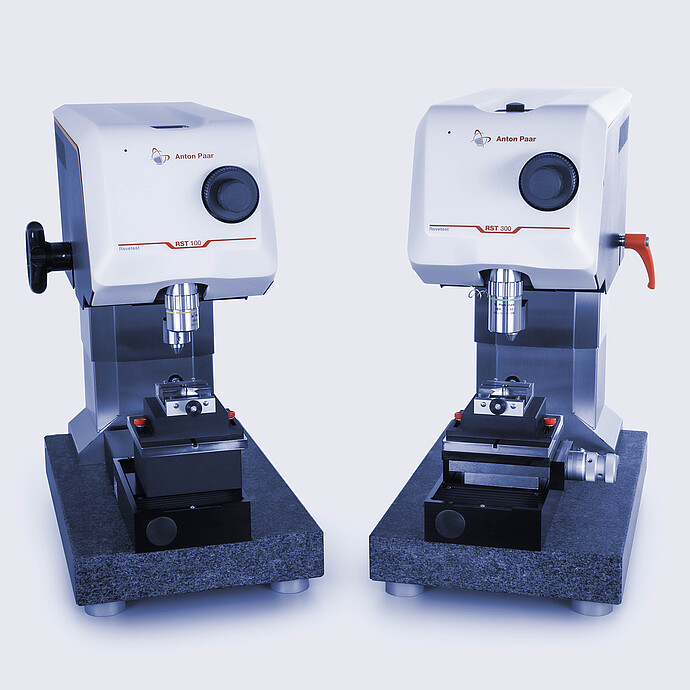 Side-by-side view of the Anton Paar Revetest® Scratch Tester RST 100 and RST 300, displaying the control heads, indenters, and testing bases for material surface testing.