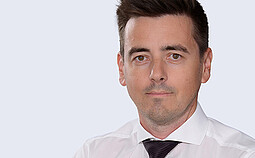 Robert Hammer, General Manager of Anton Paar Austria GmbH, in a studio portrait wearing a white shirt and dark tie
