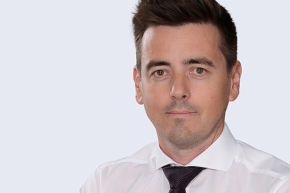 Robert Hammer, General Manager of Anton Paar Austria GmbH, in a studio portrait wearing a white shirt and dark tie