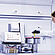 Lab technician holding a yellow vial beside Anton Paar DMA 5002 with Xsample Heating Controller and Xsample 631 sample changer carousel