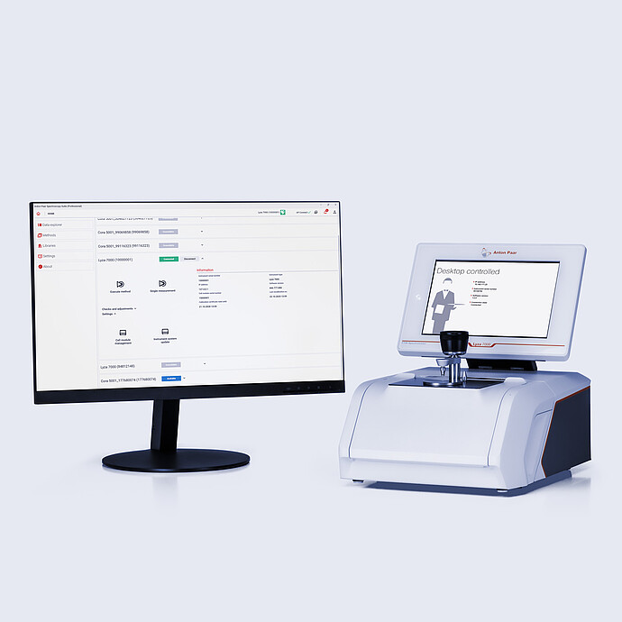 Anton Paar Lyza 7000 FTIR spectrometer with a sample holder beside a monitor displaying Anton Paar Spectroscopy Suite Professional.
