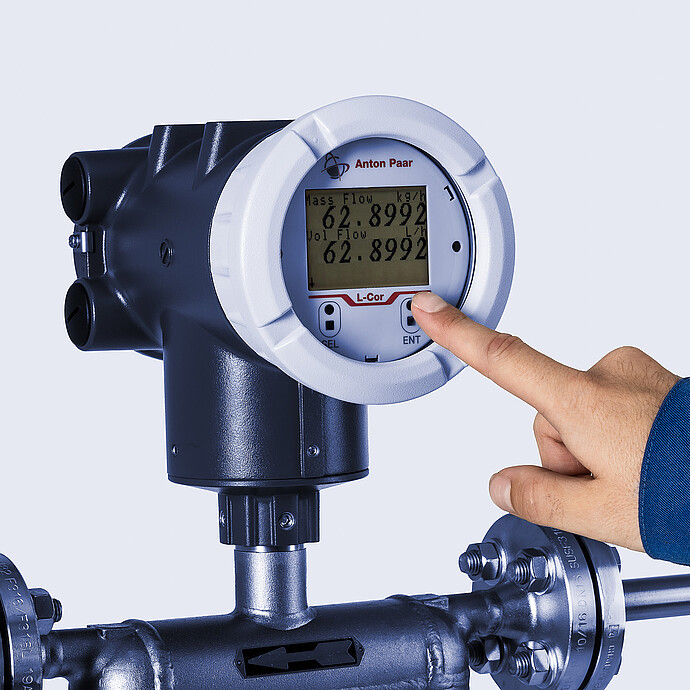 An operator working with Type U L-Cor 8000 coriolis mass flow meter transmitter