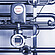 Installed Anton Paar L-Cor 8000 Coriolis flow meter with digital display mounted on stainless steel piping system with valves and sensor connections.