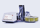 Anton Paar DMA 5002 density meter with Xsample 530 sample changer, vial carousel, bottles, tubing, and clear front cover