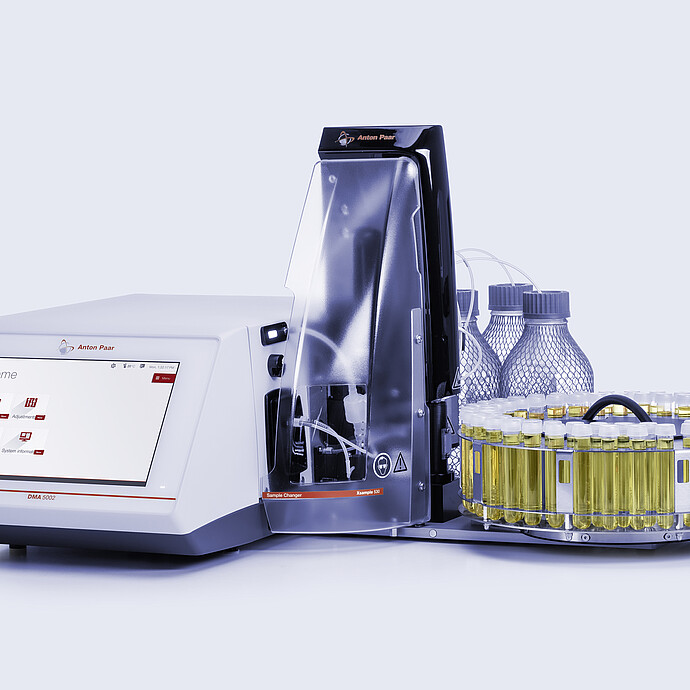 Anton Paar DMA 5002 density meter with Xsample 530 sample changer, vial carousel, bottles, tubing, and clear front cover