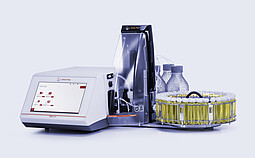 Anton Paar DMA 5002 density meter with Xsample 530 sample changer, vial carousel, bottles, tubing, and clear front cover