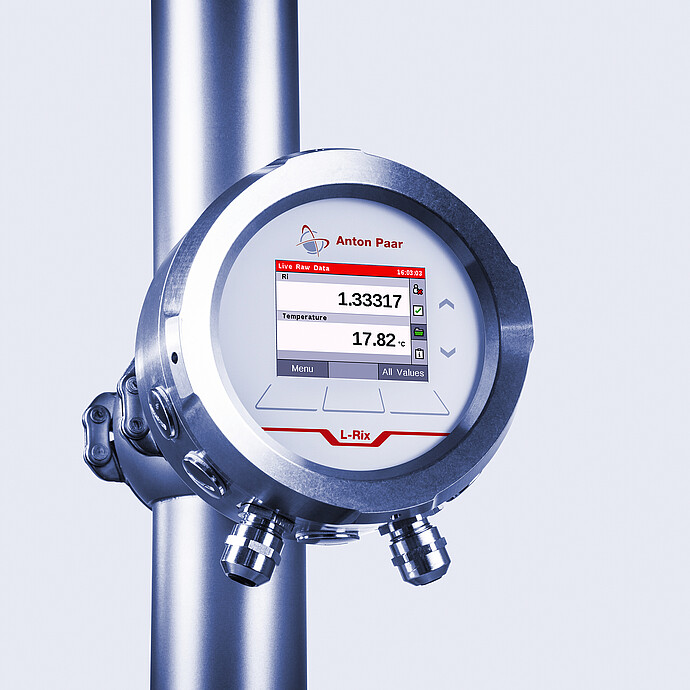 L-Rix inline refractometer mounted on a stainless steel pipe, displaying real-time refractive index and temperature measurements on its screen.