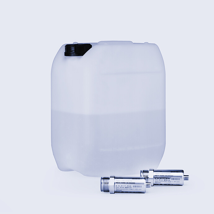 Two Anton Paar L-Rix 2100 inline refractometer sensors placed beside semi-transparent plastic container filled with liquid