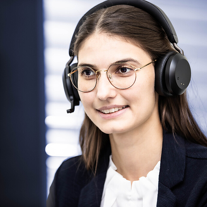 Anton Paar service specialist wearing a headset during a support call for rheology customers