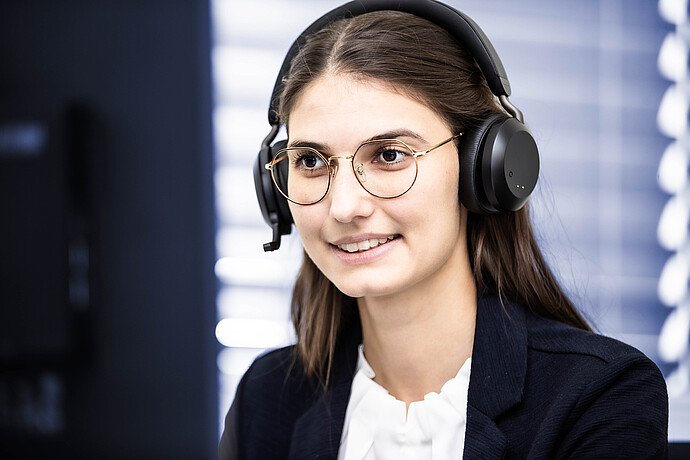 Anton Paar service specialist wearing a headset during a support call for rheology customers