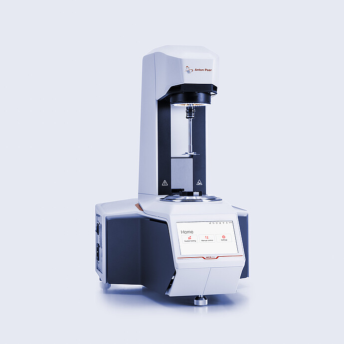 Anton Paar MCR 93 Modular Compact Rheometer in three-quarter view with open measuring area and touchscreen home menu.