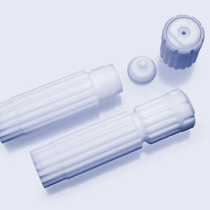Microwave digestion vessel bodies with cap and plug components on a light background.