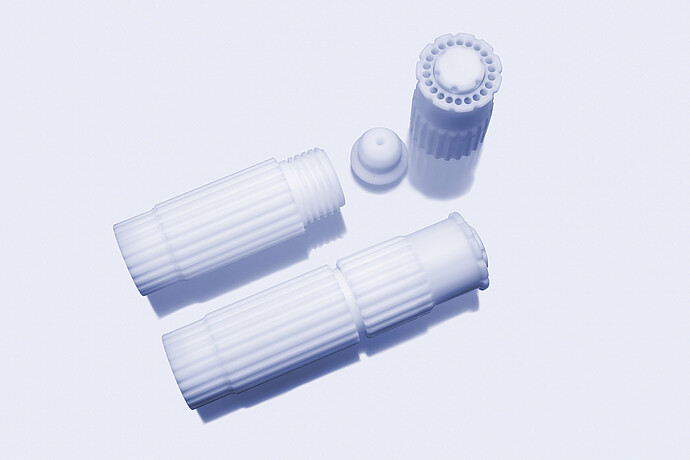 Microwave digestion vessel bodies with cap and plug components on a light background.