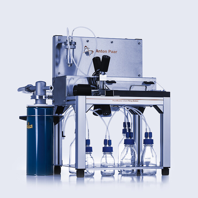 PoreMaster eGaIn Filling Station for mercury-free porosimetry, with pressure vessel, dispensing unit, and six reagent bottles connected by tubing.