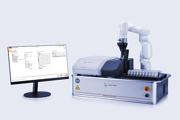 Litesizer DLS 701 nanoparticle analyzer combined with Litesizer Cuvette Sampler, with a robotic arm inserting a cuvette and a monitor displaying automation software on an Anton Paar automation platform.