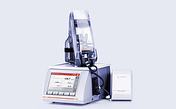 Anton Paar SVM 3001 viscometer with Xsample 610 sample changer on top, bottle holder, black tubing, and external Xsample module