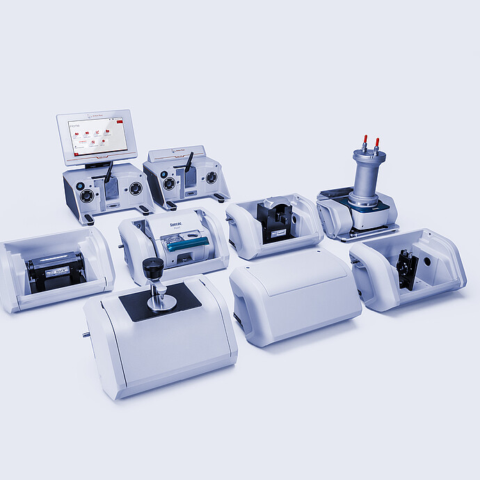 Anton Paar Lyza 7000 and Lyza 3000 FTIR spectrometers surrounded by interchangeable sampling modules and accessories.