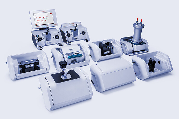 Anton Paar Lyza 7000 and Lyza 3000 FTIR spectrometers surrounded by interchangeable sampling modules and accessories.
